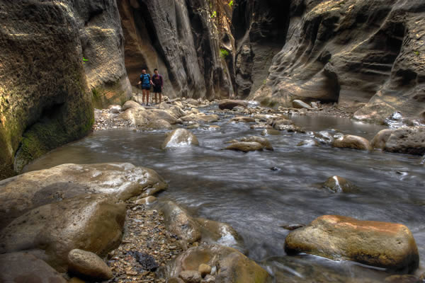 Hikers in the Narrows at Zion Canyon